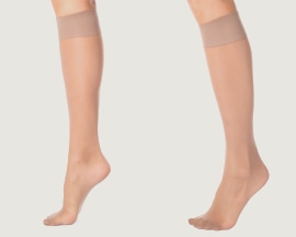 Женски крака с компресивни чорапи за предпазване от хронична венозна недостатъчност